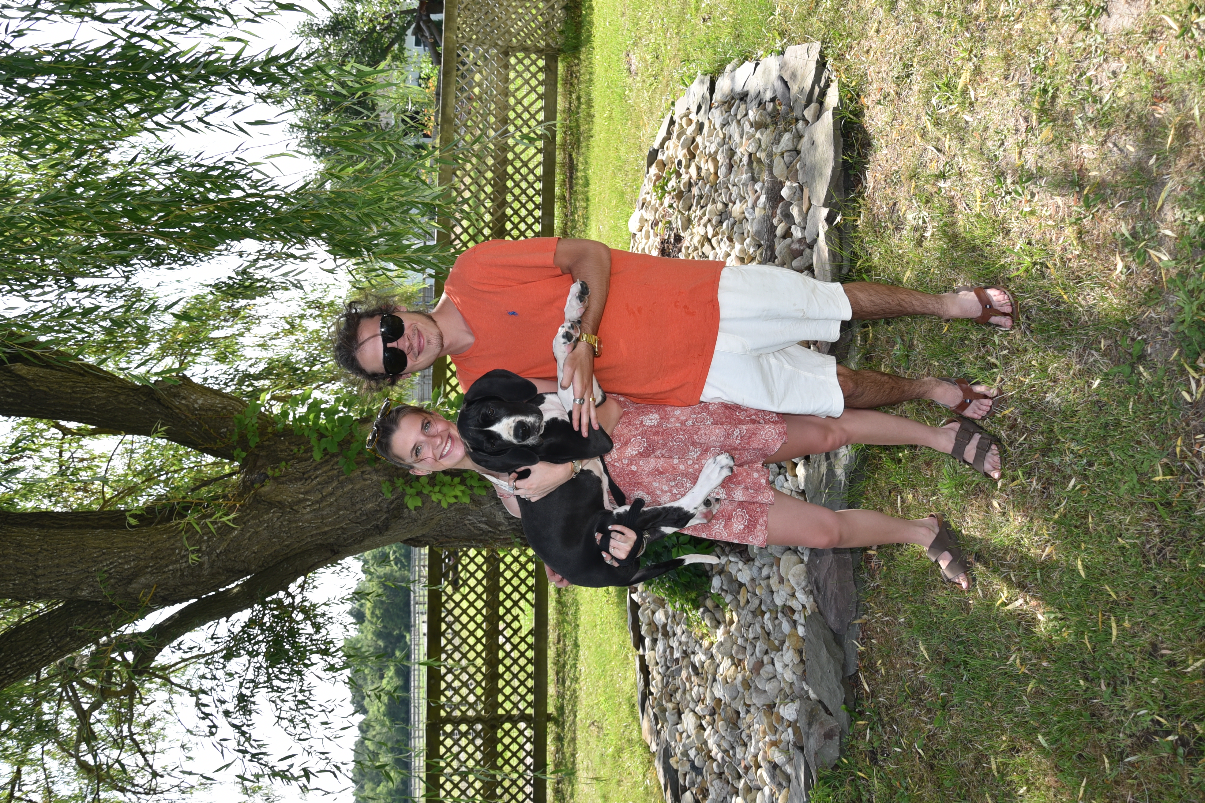Brad and Izzi holding puppy Cyrus